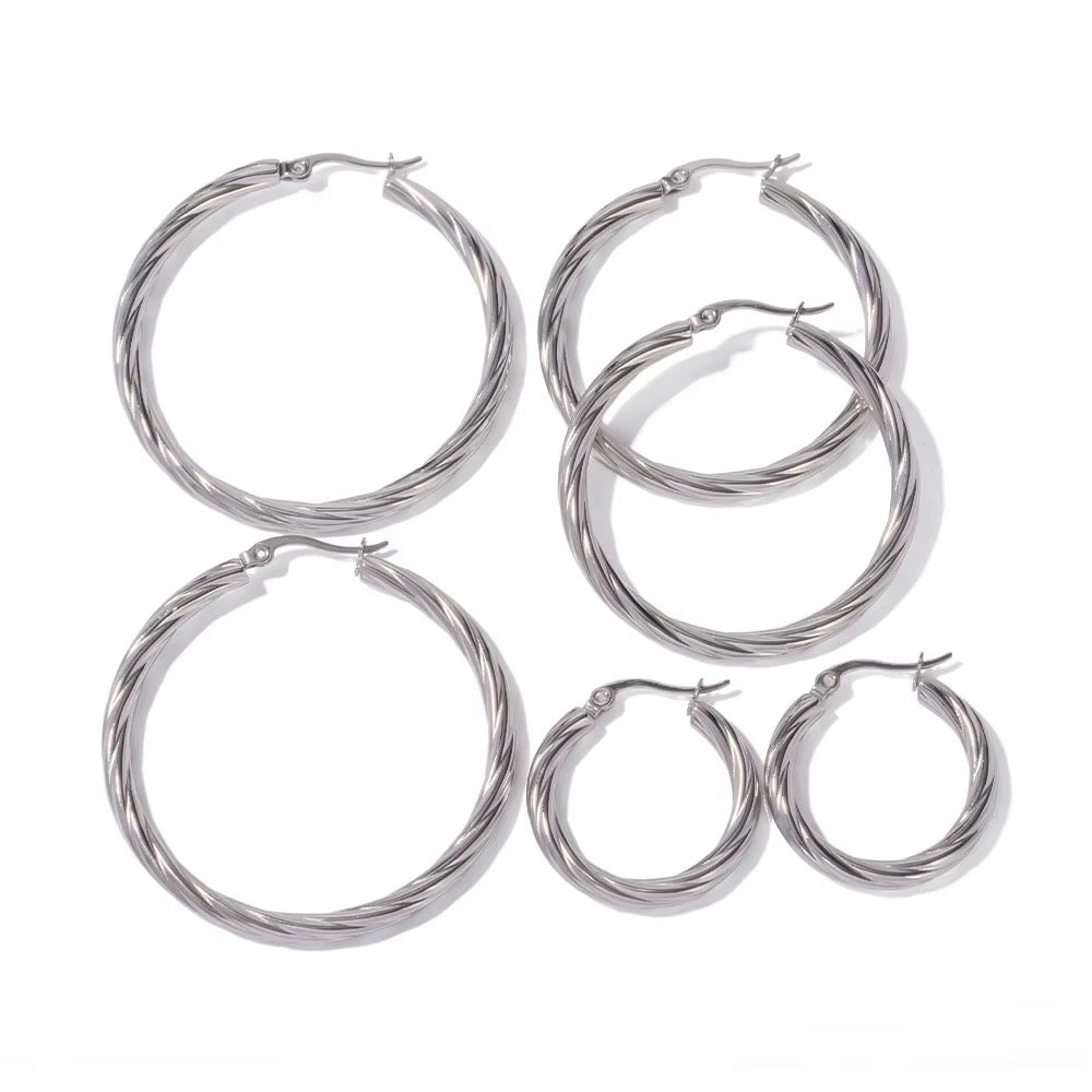 Large twisted hoop earrings in surgical steel, gilded with fine gold