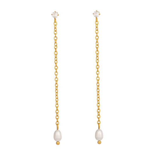 Boucles d’oreilles pendantes dorées avec chaîne fine et perle blanche. Un modèle minimaliste et élégant, idéal au quotidien comme en soirée. Hypoallergénique