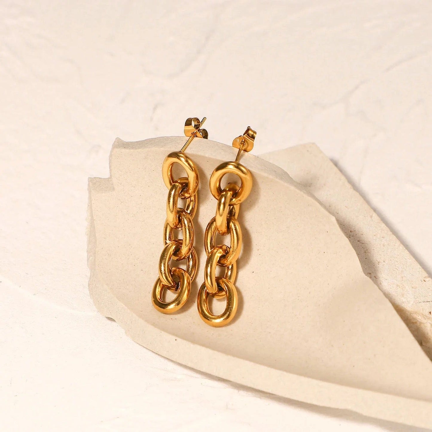 Unis  : Boucles d'oreilles pendantes