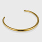 Choker ras de cou Dalia doré vu de profil, jonc ouvert lisse et brillant