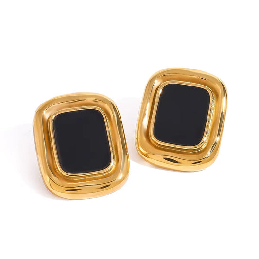 Boucles d'oreilles vintage Marylou seules sur fond blanc, cadre doré rectangulaire et pierre noire