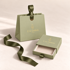 Écrin tiroir L'Or Didon ouvert et sac cadeau à ruban, prêts à offrir